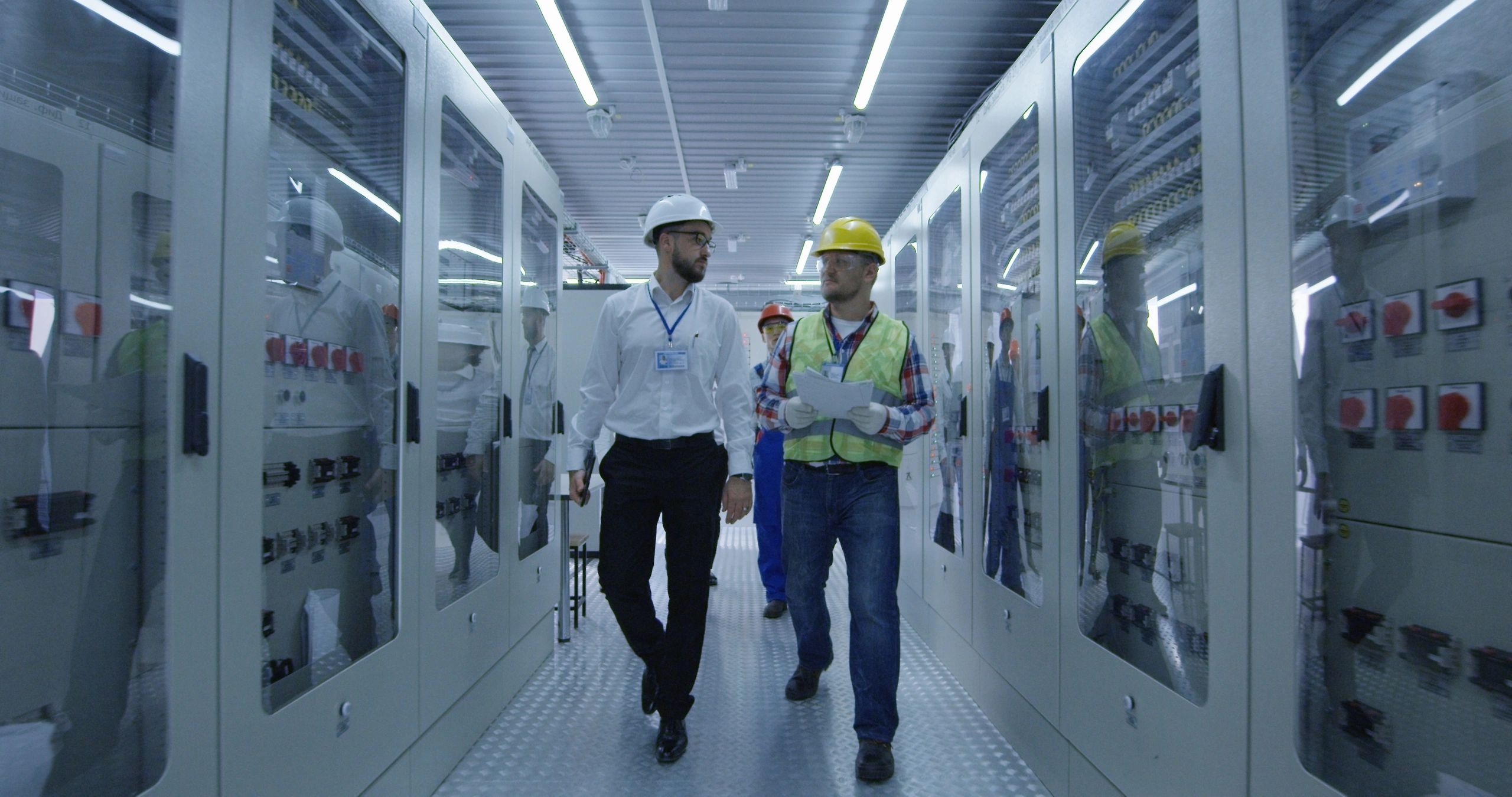 Industrial engineering professionals reviewing infrastructure operations